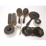 A mixed lot of silver and tortoiseshell dressing items comprising mirror, four varying brushes and