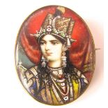 An Indian painted miniature under glass, in base metal brooch mount