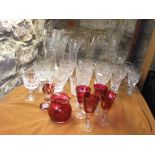 A large mixed collection of good quality glass ware to include rummers, flared vases, cranberry