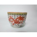 An oriental bowl with polychrome painted exotic bird, dragon and flaming pearl detail, with blue