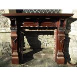A substantial Edwardian mahogany and marble lined fire surround with carved and pierced detail,