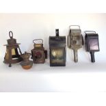 A John Oldfield vintage lorry lamp, two vintage coach lamps, a hanging lamp and a yard lamp (5)