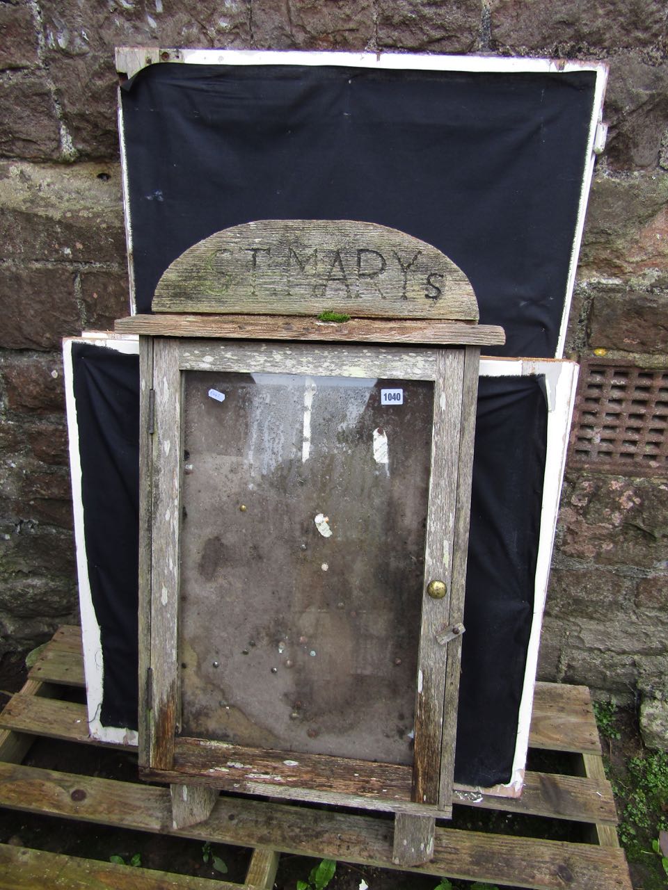 A teakwood notice board with glazed front for St Mary's church and three mirror panelled doors,