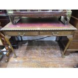 A reproduction writing table/desk of rectangular form with inset leather panel top and gadrooned