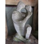 A substantial carved composition stone garden sculpture of an embracing couple, 100 cm tall approx