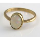 An 18ct ring with bezel set opal, size P/Q, 3g