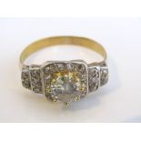 A diamond cocktail ring in unmarked yellow metal, the central claw set diamond approx 1.75cts,