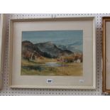 A watercolour of a mountainous lakeland landscape signed bottom left E Grieg Hall, with label