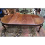A good quality Edwardian mahogany extending dining table with two additional leaves with gadroon