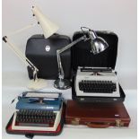 Two vintage cased typewriters together with a brown leather briefcase and two Anglepoise type lights