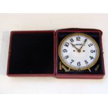 American Waltham Watch Co night clock, the 4.5 inch glass dial with brass bezel supported with a