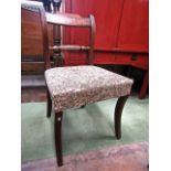 A harlequin set of four Regency mahogany dining chairs all with upholstered seats on turned and