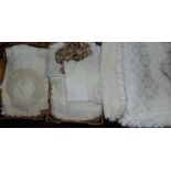 Three boxes of household linen including lace bedspread, curtain tie backs and curtain netting