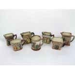 A collection of six Royal Doulton relief moulded and painted jugs from the Dickens series