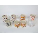 A collection of Emma Bridgewater wares including a pair of small mugs and a matching larger mug, all