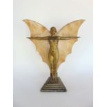 An Art Deco gilt spelter figural table lamp in the form of a nude with marble butterfly wings upon a