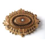 A Victorian 10ct mourning brooch with bevelled glass compartment to reverse and seed pearl to