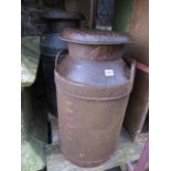 A vintage steel two handled milk churn and cap stamped South Coast Dairies Ltd; together with one