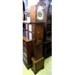 A good quality walnut cased grandmother clock, the 20cm broken arch dial with applied spandrels