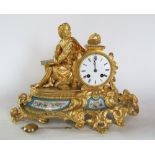 Antique French bronze and ormolu eight day figural mantel clock, the two train 9cm dial flanked by a