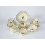 A six place Paragon China Stratford pattern tea service with printed floral sprays comprising milk