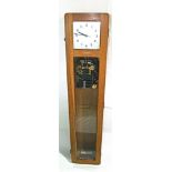 A vintage oak cased Synchronome electric master wall clock, with original pendulum, 126cm high