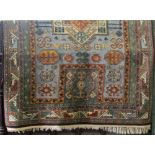 A Persian style wool carpet of heavy gauge with pale blue field, geometric panels, set within