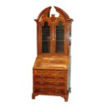 A 17th century walnut throne chair with panelled framework and enclosed base, the cresting rail with