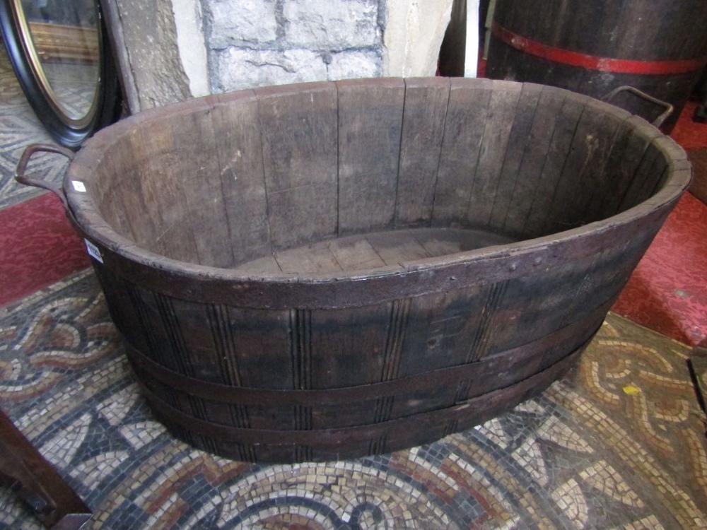 An oval oak coopered tub with handle, 100 cm max