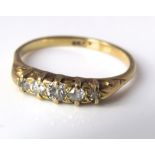 An 18ct five stone diamond ring, size S, 3.5g