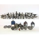 A large collection of Georgian and later pewter condiments peppers, salts, measures, flasks, etc