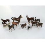 A collection of ceramic models of horses including a Beswick model of a new forest type pony, a matt