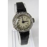 An early 20th century platinum and diamond bezel ladies cocktail watch, fitted with a fifteen