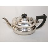 A silver teapot, the body of oval compressed form, Birmingham 1933, 19 oz all in