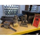 A 19th century cast iron door stop in the form of a lion, a coach lamp,a heavy iron trivet, fire