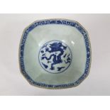 A 19th century oriental blue and white bowl of square shaped form with painted dragon detail to