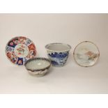 A collection of oriental ceramics including a blue and white painted cachepot with painted landscape
