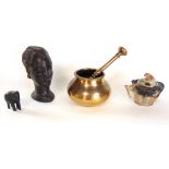 A mixed lot to include two tribal carvings, Chinese soapstone teapot and an antique pestle and