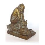 A 1920s French bronze study of a grotesque woman in the manner of Honore Daumier with a snake at her