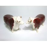 A Beswick model of a Hereford champion bull and Hereford champion cow