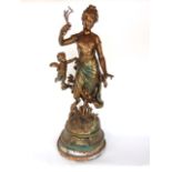 A cast bronzed spelter figure of a maiden in robes with a cherub at her side, with plaque