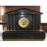 A 19th century single train black slate mantle clock with architectural case fitted with