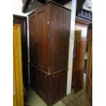 A substantial Victorian pine two tier food or linen cupboard enclosed by two pairs of panelled