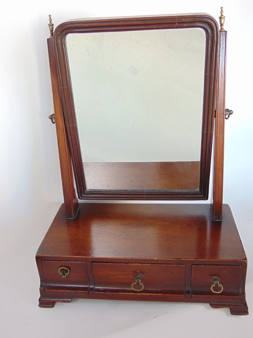 A Georgian mahogany swing mirror upon a base fitted with three cushion drawers together with a - Image 2 of 3