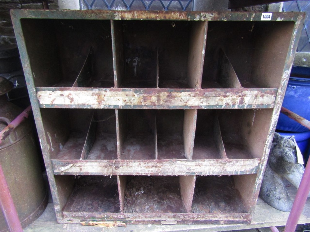 A pair of vintage steel workshop shelves, each on three tiers and with segmented partitions