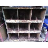 A pair of vintage steel workshop shelves, each on three tiers and with segmented partitions
