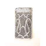 An eastern white metal card case, with embossed scrolled floral decoration, 2oz approx