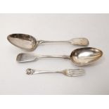 A matched pair of Victorian Scottish silver fiddle pattern serving spoons; together with a further