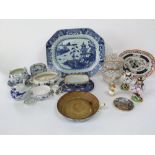 A 19th century oriental blue and white meat plate with pagoda and fishing boat decoration, 40cm long