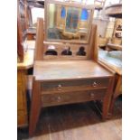 A Liberty & Co dressing chest fitted with two frieze drawers with original copper ring handles